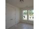 Cozy bedroom with double door closet and two windows offering natural light and outdoor views at 2040 Ripple Park Bnd, Canton, GA 30114
