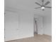A modern bedroom featuring recessed lighting, neutral tones, and two closets at 2040 Ripple Park Bnd, Canton, GA 30114