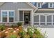 Charming single-Gathering home with a two-car garage, manicured lawn, and stone accents at 2040 Ripple Park Bnd, Canton, GA 30114