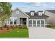 Charming single-Gathering home with a two-car garage, manicured lawn, and stone accents at 2040 Ripple Park Bnd, Canton, GA 30114