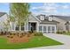 Charming single-Gathering home with a two-car garage, manicured lawn, and stone accents at 2040 Ripple Park Bnd, Canton, GA 30114