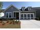 Charming single-Gathering home featuring a two-car garage, and craftsman style front porch at 2040 Ripple Park Bnd, Canton, GA 30114