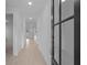 Bright hallway with gleaming floors and white walls, leading to various rooms at 2040 Ripple Park Bnd, Canton, GA 30114