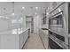 Modern kitchen with stainless appliances, an island, and bright pendant lights at 2040 Ripple Park Bnd, Canton, GA 30114