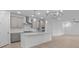 Bright kitchen with a large island, stainless steel appliances, and modern pendant lighting at 2040 Ripple Park Bnd, Canton, GA 30114