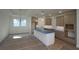 Modern kitchen boasts an island, updated cabinets, and ample counter space at 2040 Ripple Park Bnd, Canton, GA 30114