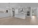 Modern open-concept kitchen with island, pendant lights, and stainless appliances at 2040 Ripple Park Bnd, Canton, GA 30114