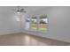 Open living room with hardwood floors and large windows provides lots of light at 2040 Ripple Park Bnd, Canton, GA 30114
