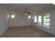 Inviting living room with a ceiling fan and multiple windows offering plenty of natural light at 2040 Ripple Park Bnd, Canton, GA 30114