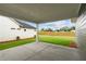 A covered patio provides a comfortable outdoor living space and view of the yard at 2040 Ripple Park Bnd, Canton, GA 30114
