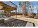 Backyard patio with stairs to deck. Features large grassy area and perimeter fence at 4310 Red Rock Pt, Suwanee, GA 30024