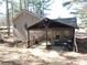 This backyard patio is a cozy extension of the home, perfect for outdoor dining and relaxation at 4678 Browns Mill Ferry Rd, Lithonia, GA 30038