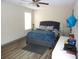 Bright bedroom with a comfortable bed, stylish decor, and ample space for relaxation at 4678 Browns Mill Ferry Rd, Lithonia, GA 30038