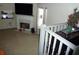 Bright living room featuring tile flooring, a fireplace, and a large television at 4678 Browns Mill Ferry Rd, Lithonia, GA 30038