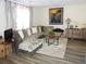 Cozy living room features a plush sectional sofa, decorative rug, and stylish furnishings at 4678 Browns Mill Ferry Rd, Lithonia, GA 30038