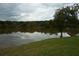 Enjoy the serene views of the calm pond with lush greenery, creating a peaceful environment at 4678 Browns Mill Ferry Rd, Lithonia, GA 30038