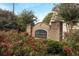 Southfield Station brick entrance sign surrounded by lush landscaping and flowering bushes at 1843 Grove Way, Hampton, GA 30228