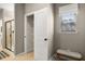Hallway area with a view of the shower, closet, and bench under the window at 208 Bastian Dr # 108, Villa Rica, GA 30180