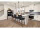 Stylish kitchen with white cabinetry, stainless steel appliances, and a center island with bar stools at 208 Bastian Dr # 108, Villa Rica, GA 30180