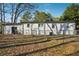Spacious backyard includes an open yard and white house with small windows at 2283 Noahs Ark Rd, Jonesboro, GA 30236