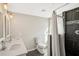 Modern bathroom featuring dual sinks, a toilet, and a stylish shower with a shower curtain at 2283 Noahs Ark Rd, Jonesboro, GA 30236