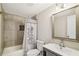 Updated bathroom features a tub/shower combo, neutral tile surround, and a modern vanity at 2283 Noahs Ark Rd, Jonesboro, GA 30236