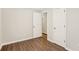 Bright bedroom offers wood-look floors, neutral walls and doors to hallway and closet at 2283 Noahs Ark Rd, Jonesboro, GA 30236
