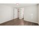 Spacious bedroom with hardwood floors and a walk-in closet leading to a bathroom at 2283 Noahs Ark Rd, Jonesboro, GA 30236