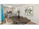 Virtually staged dining room with wooden table, adjacent to open-concept living area at 2283 Noahs Ark Rd, Jonesboro, GA 30236