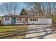 Charming single-story home with a well-manicured lawn and an attached one car garage at 2283 Noahs Ark Rd, Jonesboro, GA 30236