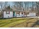 Charming single-story home featuring a bright teal front door and well-maintained front yard at 2283 Noahs Ark Rd, Jonesboro, GA 30236