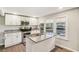 Modern kitchen featuring granite countertops, stainless steel appliances, and bright white cabinetry at 2283 Noahs Ark Rd, Jonesboro, GA 30236