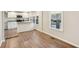 Bright kitchen with stainless steel appliances, granite countertops, and vinyl plank flooring at 2283 Noahs Ark Rd, Jonesboro, GA 30236