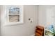 Well-lit laundry room featuring a window with natural light and convenient shelving at 2283 Noahs Ark Rd, Jonesboro, GA 30236
