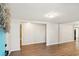 Bright and airy living room with wood-look floors and a fresh, neutral color palette at 2283 Noahs Ark Rd, Jonesboro, GA 30236