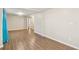 Spacious living room with wood-look floors, offering a blank canvas for personalized decor at 2283 Noahs Ark Rd, Jonesboro, GA 30236