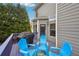 Back deck with blue outdoor seating, grill, and exterior view of the house at 4740 Arbor Meadows Dr, Cumming, GA 30040