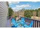 Spacious back deck with chairs, table, and view of the surrounding landscape at 4740 Arbor Meadows Dr, Cumming, GA 30040