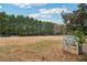 Wide backyard view with playhouse, trampoline and privacy fence at 4740 Arbor Meadows Dr, Cumming, GA 30040