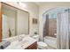 Well-lit bathroom with a tiled shower, vanity, and modern fixtures at 4740 Arbor Meadows Dr, Cumming, GA 30040
