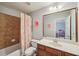 bathroom with shower/tub combo and a vanity at 4740 Arbor Meadows Dr, Cumming, GA 30040