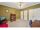 Bedroom featuring carpet, ceiling fan, natural light, and closet space at 4740 Arbor Meadows Dr, Cumming, GA 30040