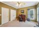 Bedroom featuring carpet, ceiling fan, natural light, closet, and workspace at 4740 Arbor Meadows Dr, Cumming, GA 30040