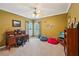 Comfortable bedroom with a ceiling fan, natural light, and space for a desk and seating at 4740 Arbor Meadows Dr, Cumming, GA 30040