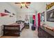 Charming bedroom with sports decor, comfortable bed, and natural light at 4740 Arbor Meadows Dr, Cumming, GA 30040