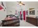 Charming bedroom with sports decor, comfortable bed, and natural light at 4740 Arbor Meadows Dr, Cumming, GA 30040