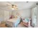 bedroom with a bed, chair and window at 4740 Arbor Meadows Dr, Cumming, GA 30040