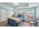 Cozy bedroom featuring a blue-painted ceiling and walls and a metal bed frame at 4740 Arbor Meadows Dr, Cumming, GA 30040