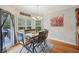 Inviting dining space featuring wood floors, an outdoor view, and casual seating at 4740 Arbor Meadows Dr, Cumming, GA 30040