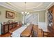 Formal dining room with a large table, classic decor, and hardwood flooring for elegant entertaining at 4740 Arbor Meadows Dr, Cumming, GA 30040